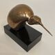 Bronze sculpture representing a stylised bird on a black marble base, signed and numbered.