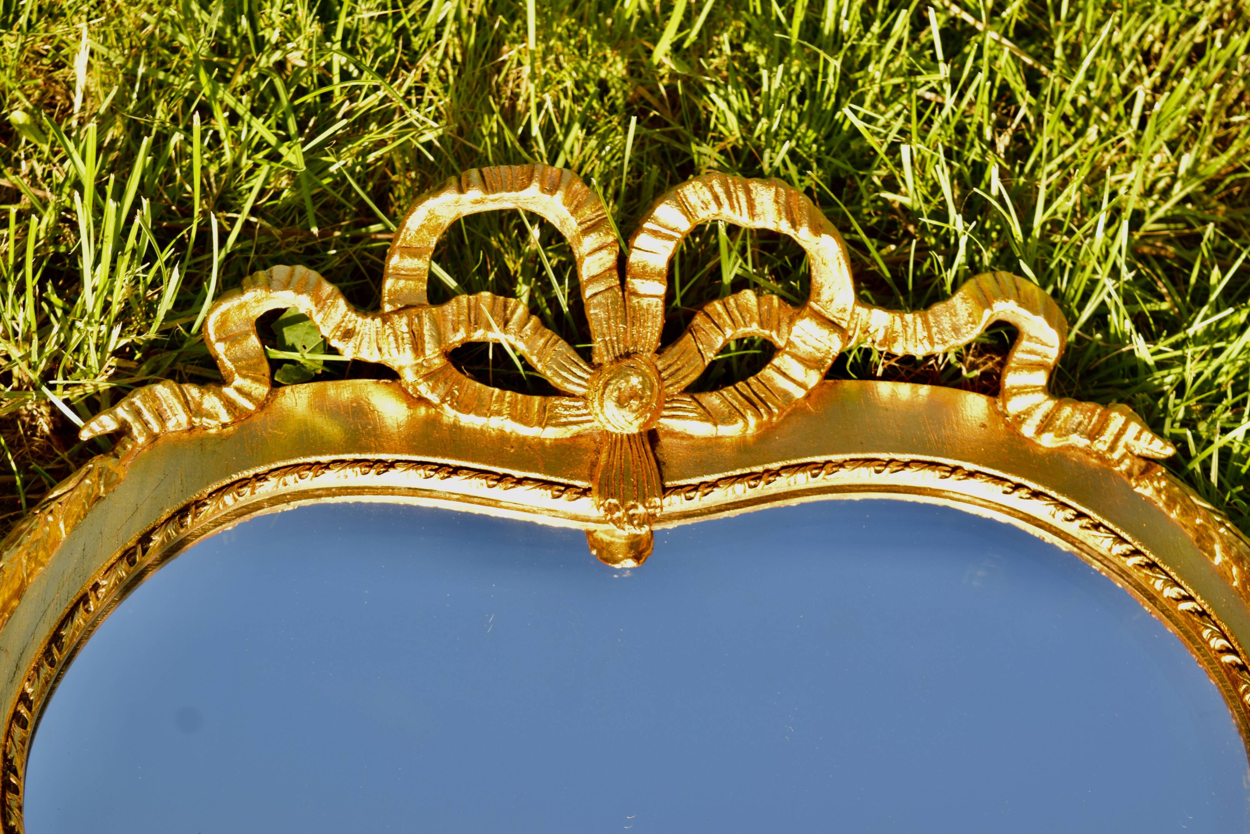 Large Louis XVI style beveled mirror in gilded painted wood - H: 78 cm - 1960