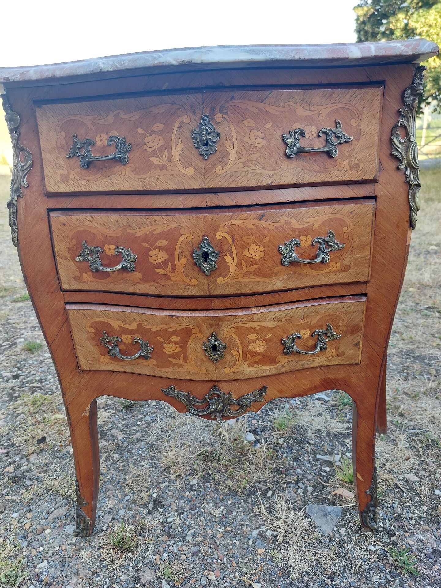 Curved commode in rosewood, Louis XV style.