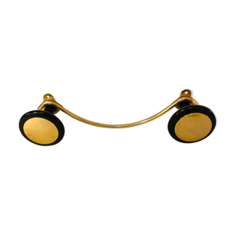 Gold and black metal coatrack 1960