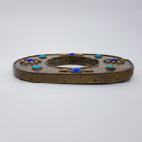 Brass oval mirror and blue cabochons