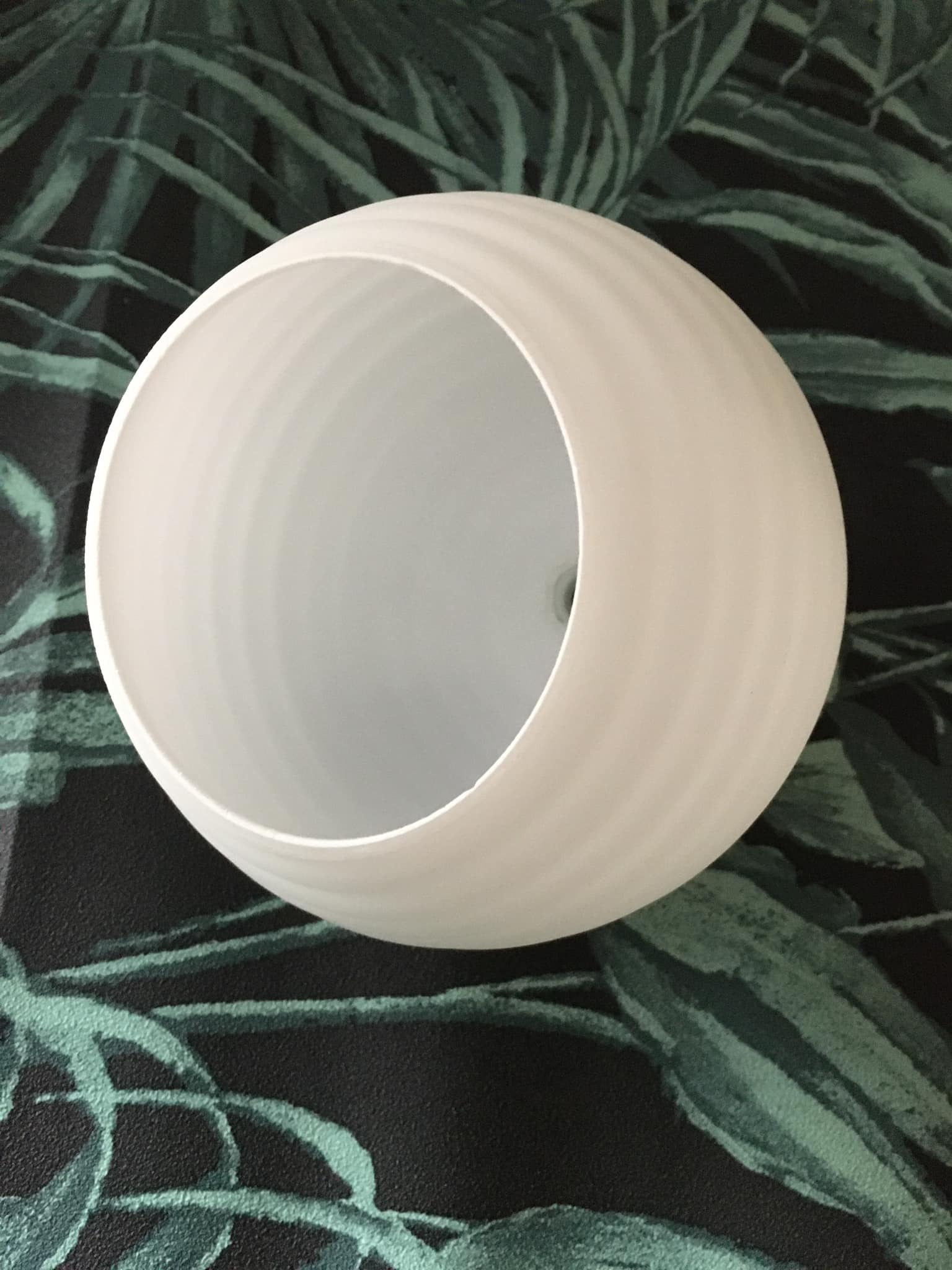 Spherical globe in white opal striated patterns