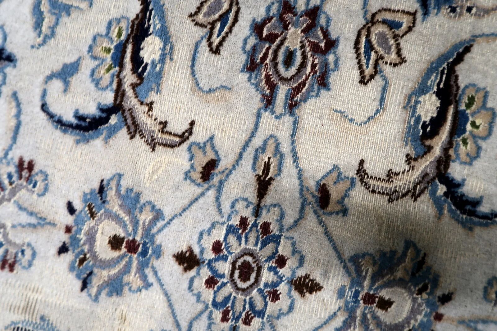 1950s hand-knotted wool rug with silk highlights, ivory and blue, 118 × 200 cm