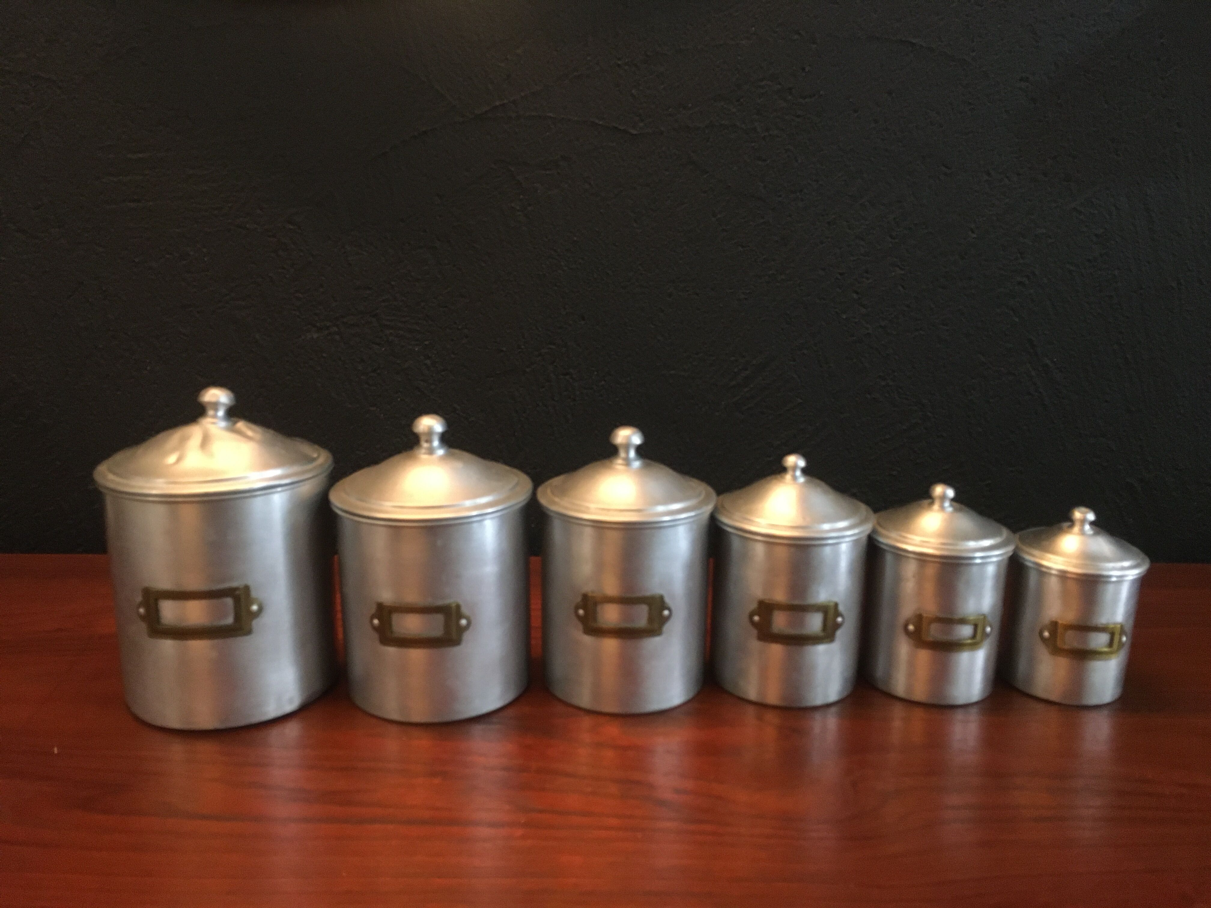 Six aluminum spice pots