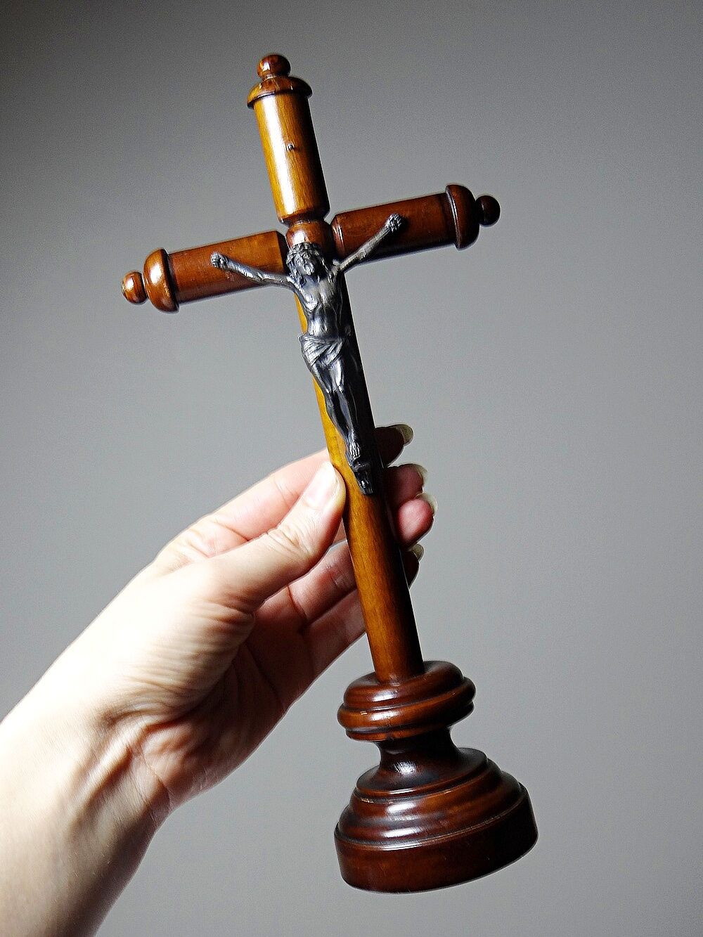 Antique wooden altar crucifix with a turned design and silver-plated Christ.