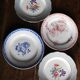 A set of 4 flat plates in pink and blue with Fontanges flowers from Sarreguemines.