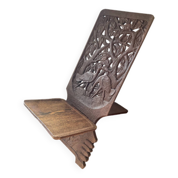 Chaise vintage à palabre en bois sculpté