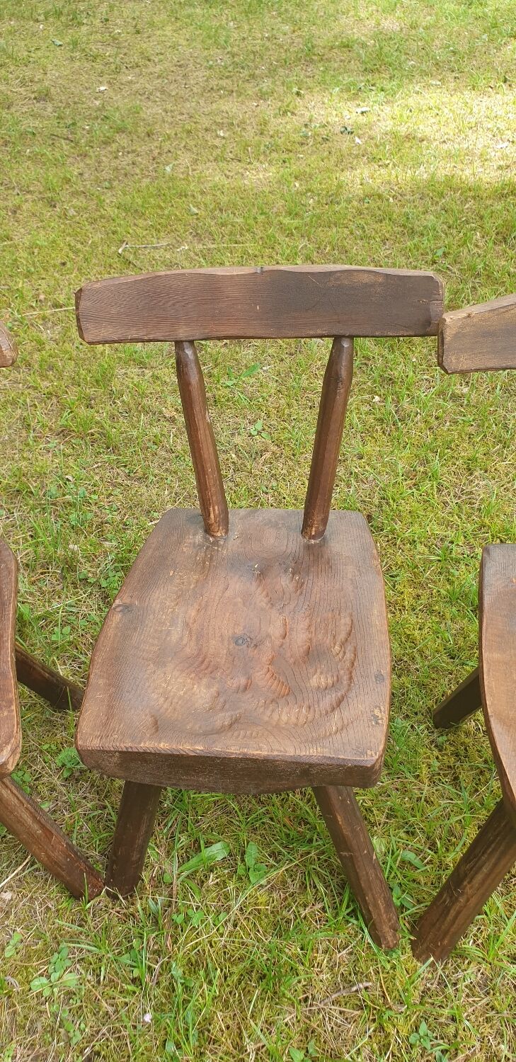 Four chairs and brutalist coffee table