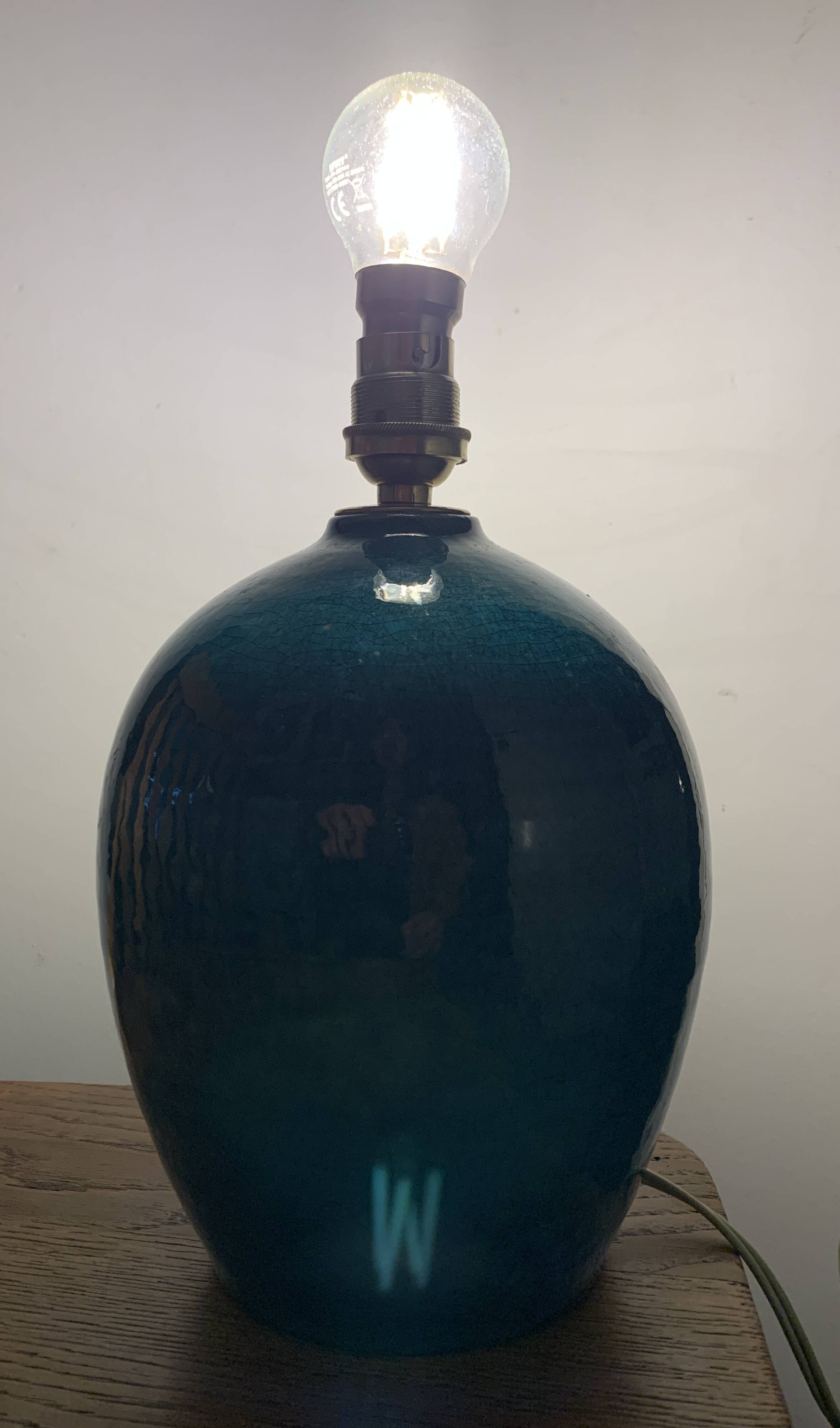 Cracked and signed ceramic ball lamp base, blue-green tones