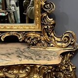 Mirror set with baroque style gilded wood console on marble top.