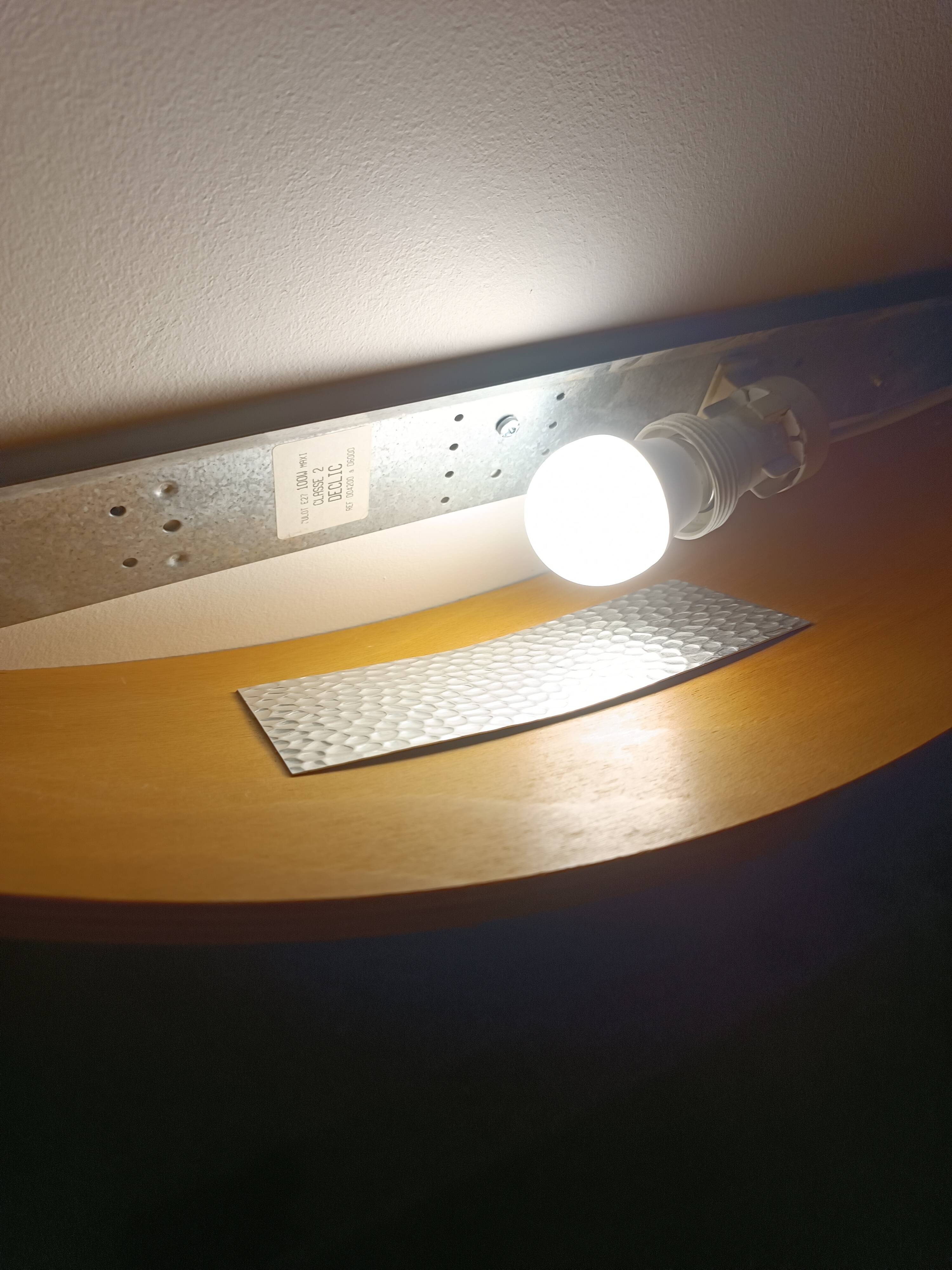 Large wooden and brass wall lights by Declic France, 1980s.