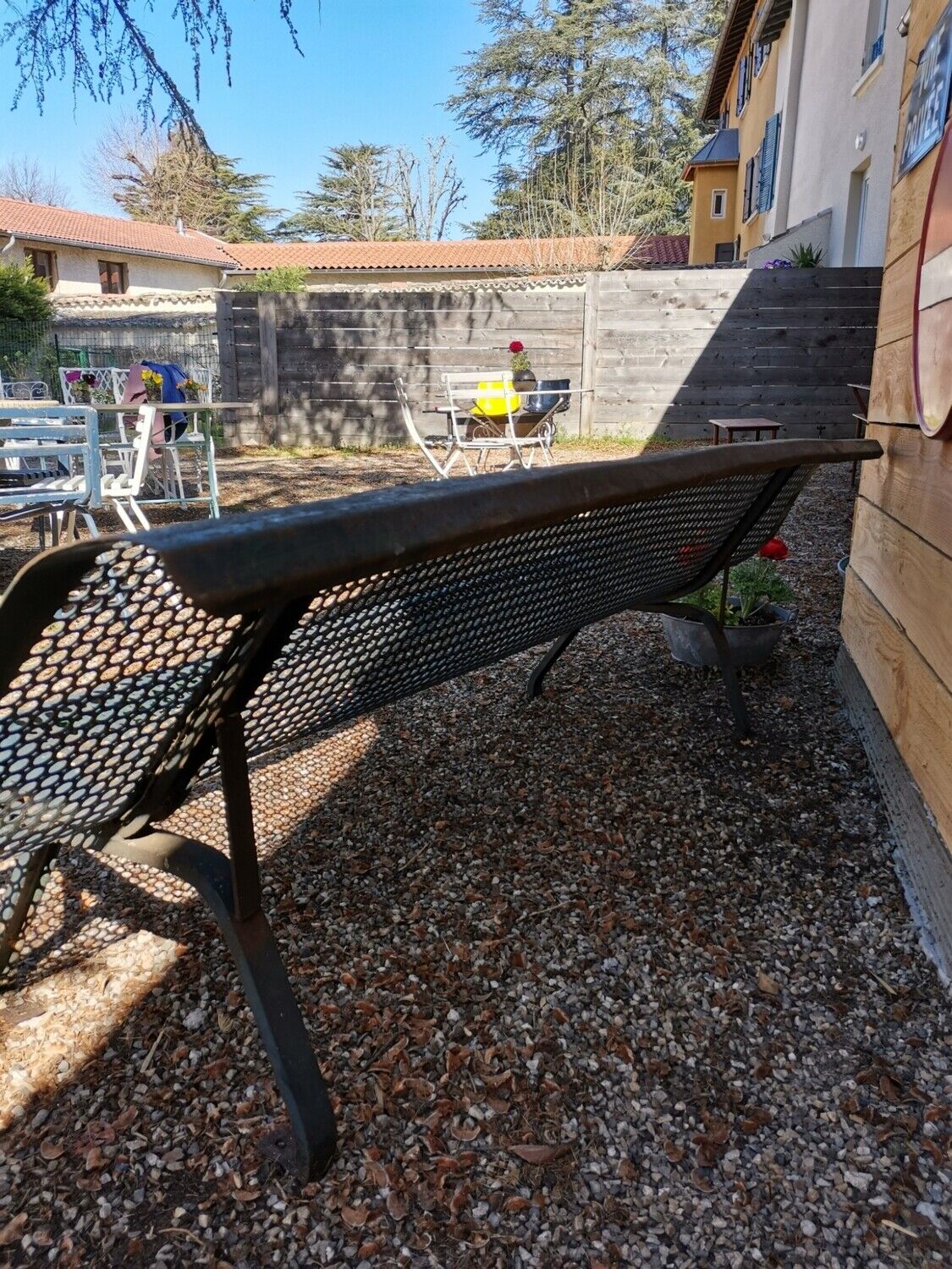 Former garden bench in perforated sheet metal