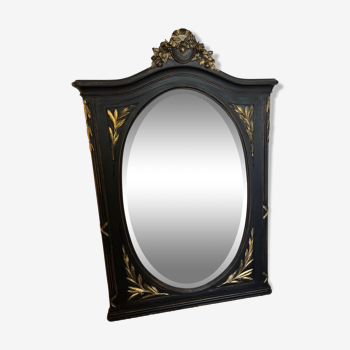 Large old trumeau mirror in black and gilded wood Napoleon style