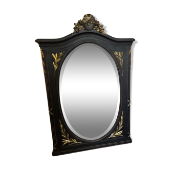 Large old trumeau mirror in black and gilded wood Napoleon style