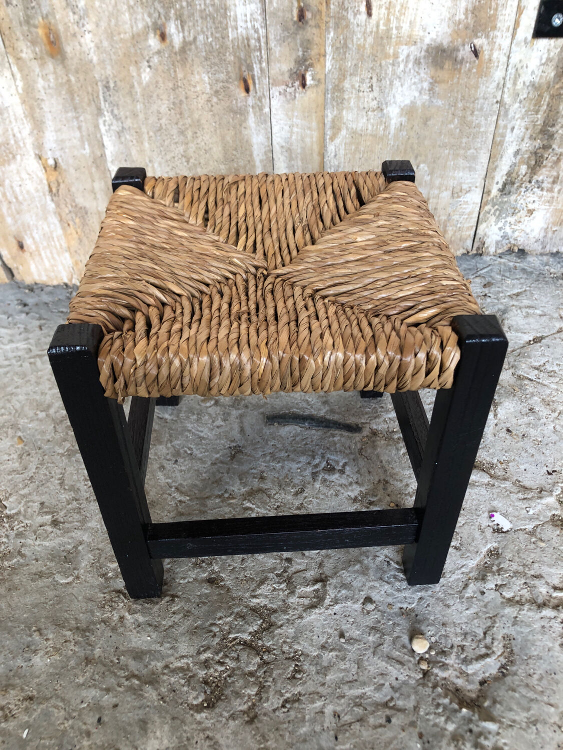 Black wood foot rest stool & vintage mulched seat