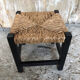 Black wood foot rest stool & vintage mulched seat