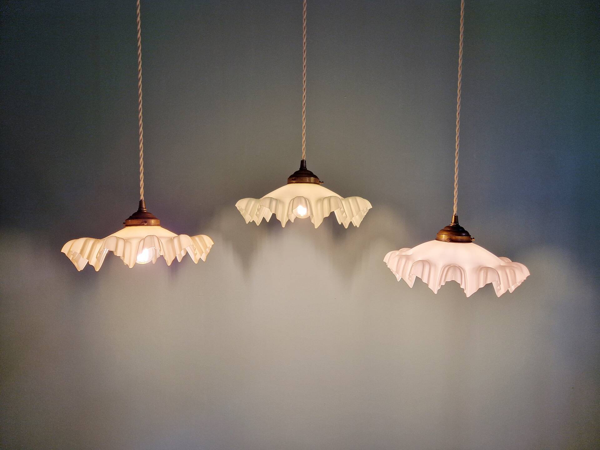 Art Deco trio of suspensions in coloured frilled opaline, 1920-30.