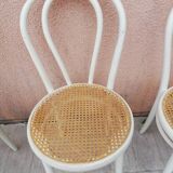 Lot of three Vintage ecru natural cane bistro chairs