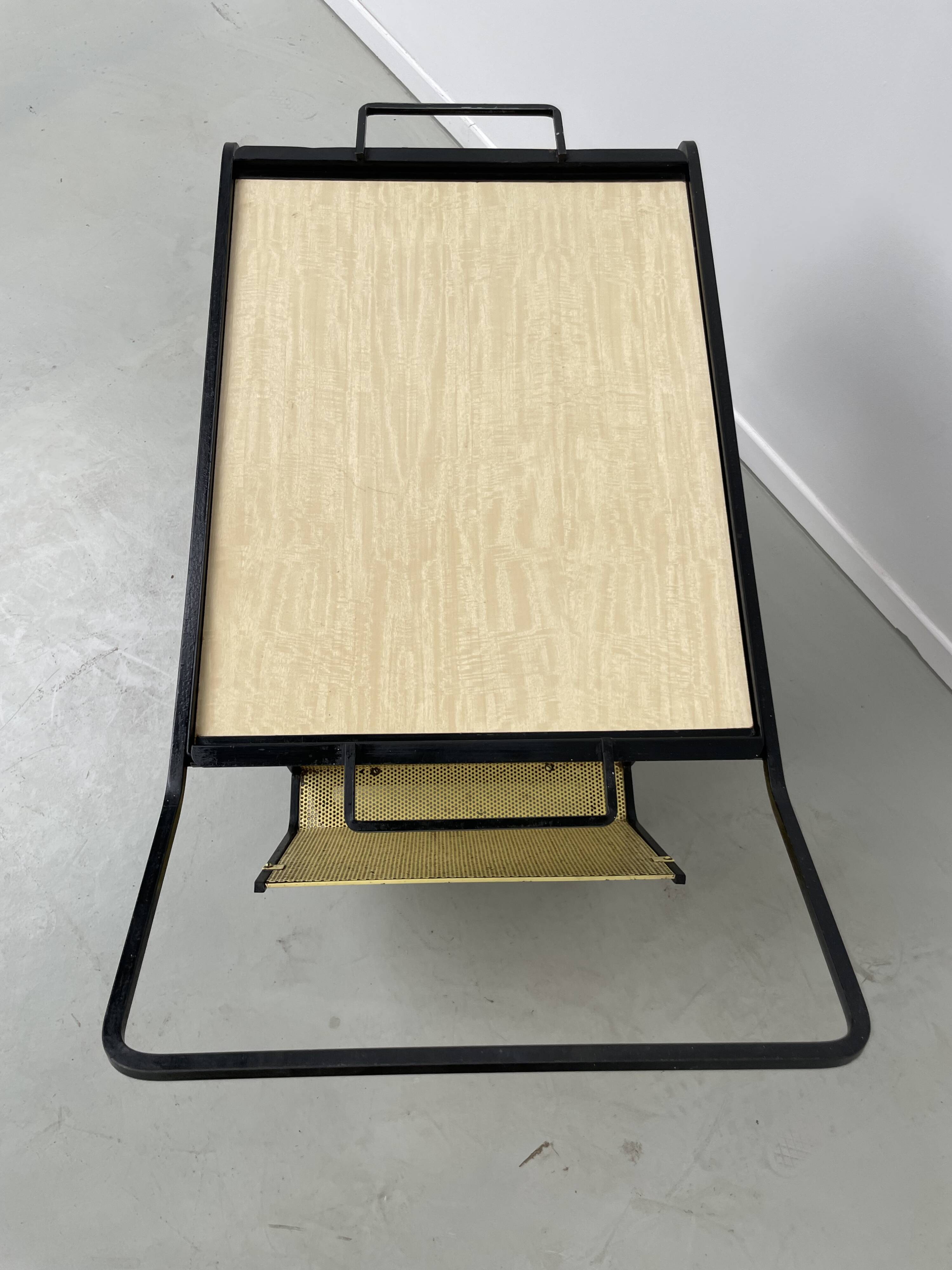 Perforated metal serving trolley in the Mathieu Matégot style