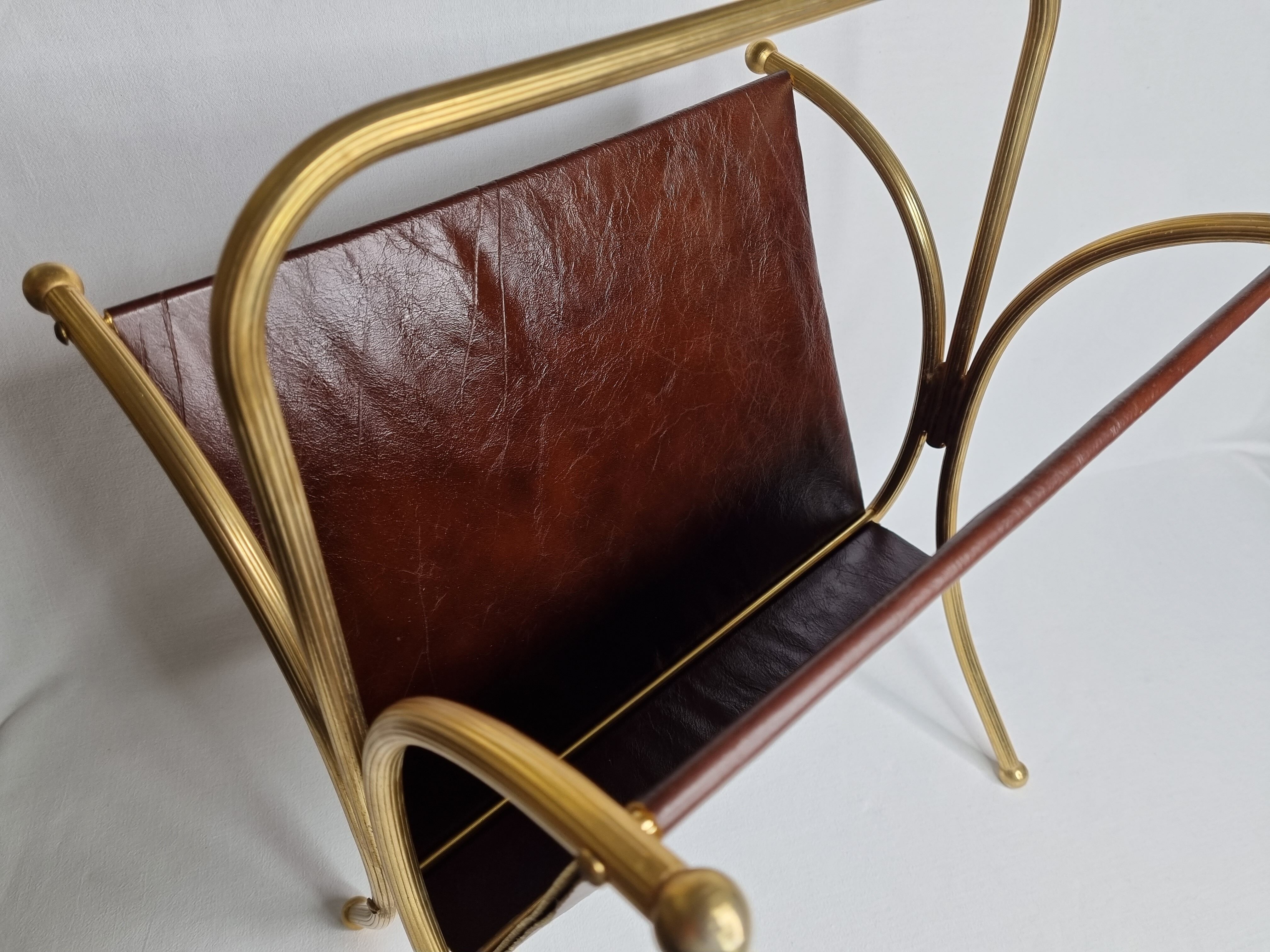 Vintage magazines and gold and leather brass