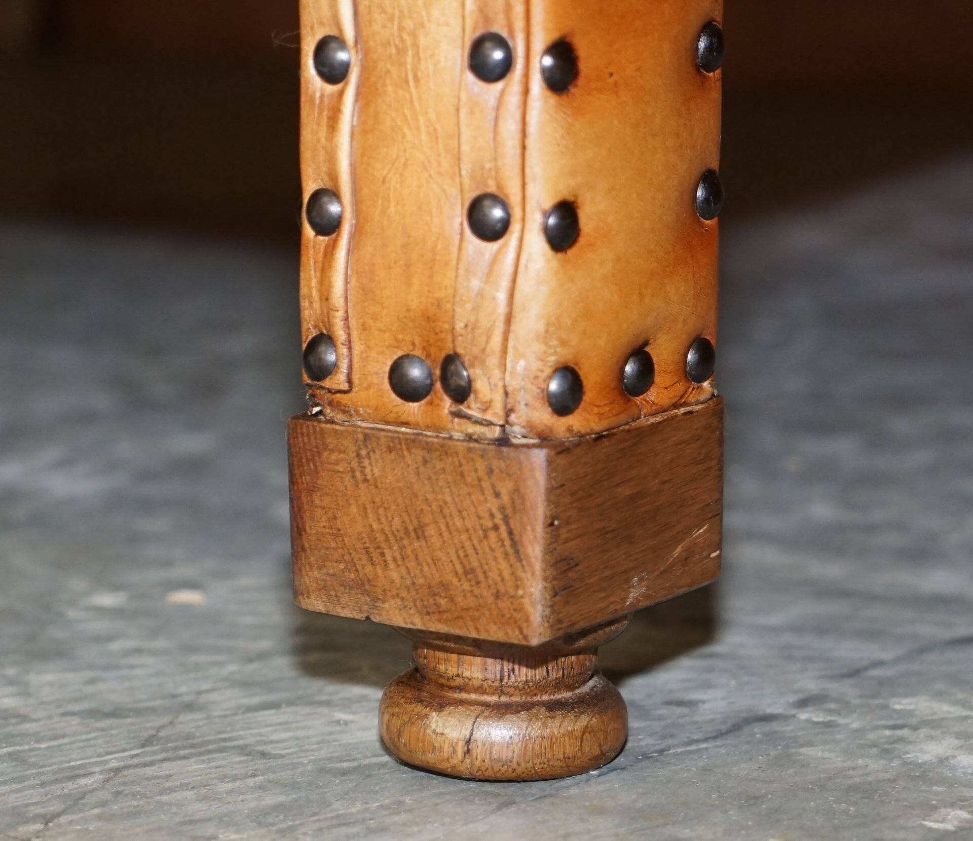 Two-seater leather canapé, hand-tanned, Edwardian style with studs.