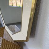Octagonal mirror in white lacquer with brass surround