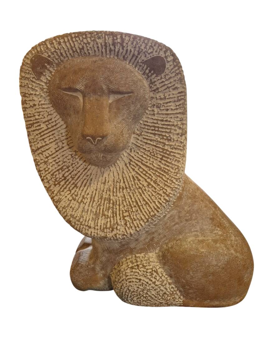 Sculpture of a lion in stone by Islay Grimes.