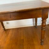 Walnut bistro table, feet turned.