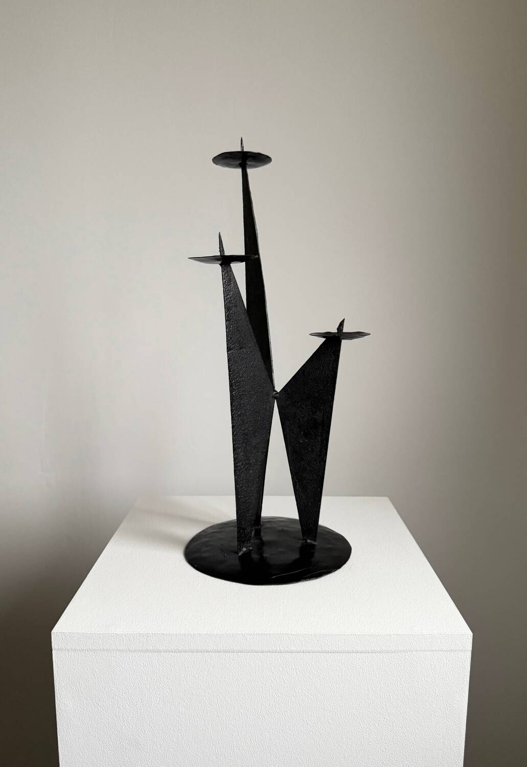 Vintage black metal brutalist tripod candlestick