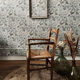 Fauteuil vintage en bois et assise paillée
