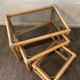 Trio of vintage pull-out tables in rattan and smoked glass 70s