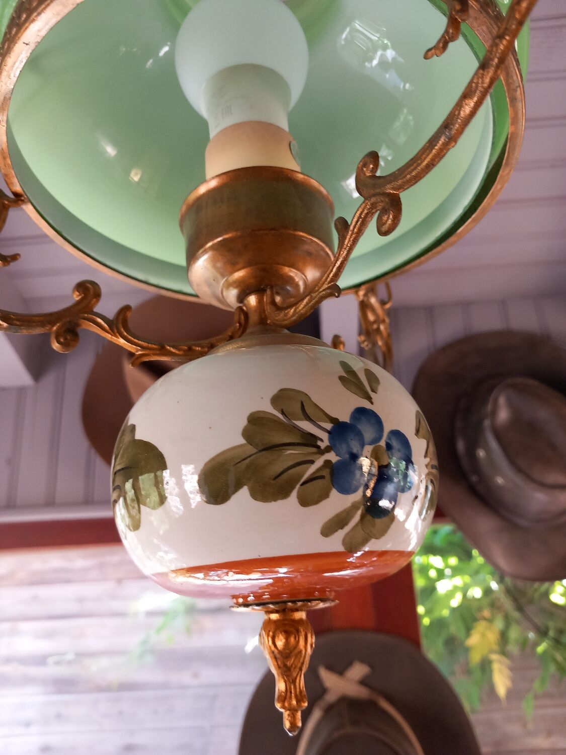 Old green opaline chandelier, gold metal and earthenware