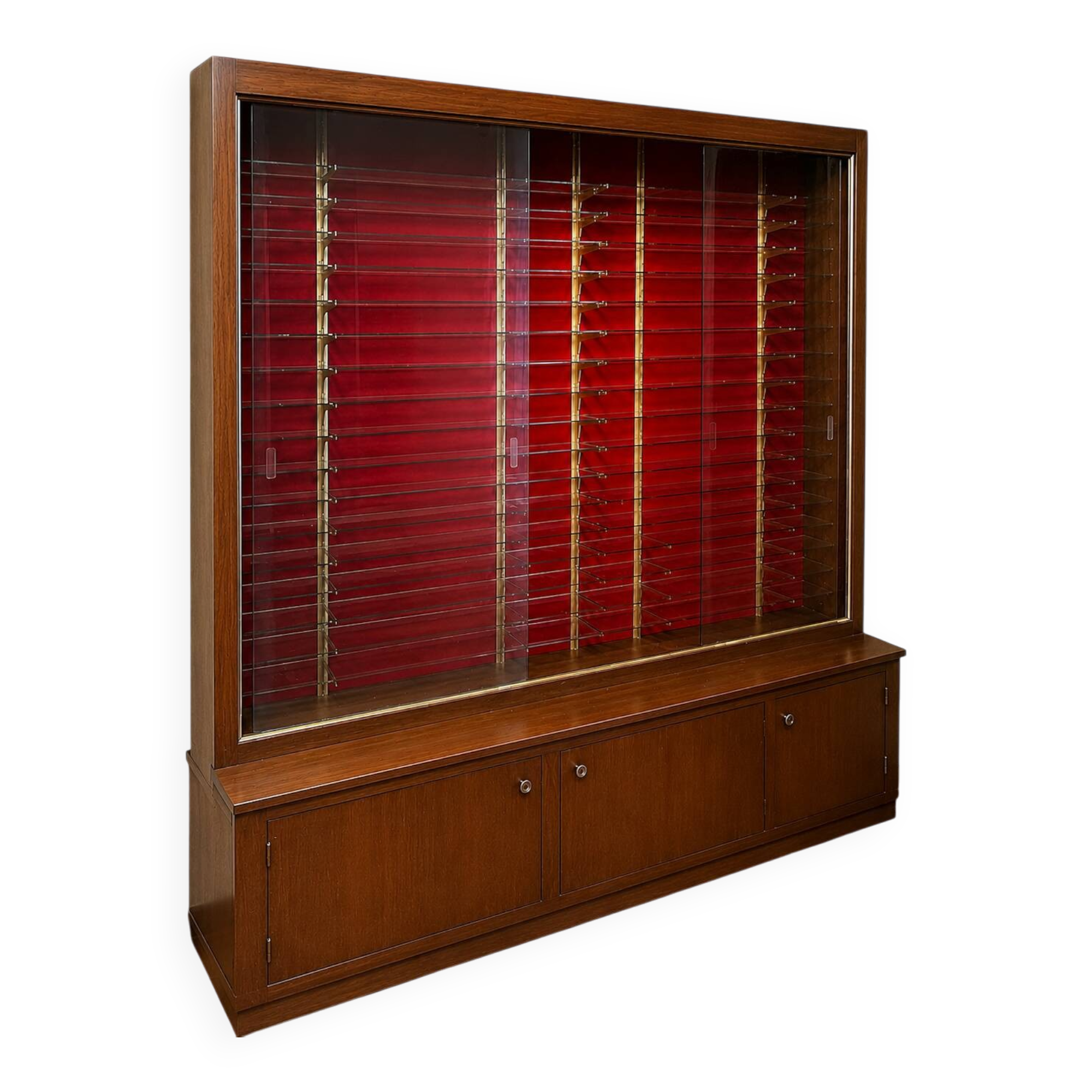 Large vintage display cabinet in wood and glass – red background, 15 shelves