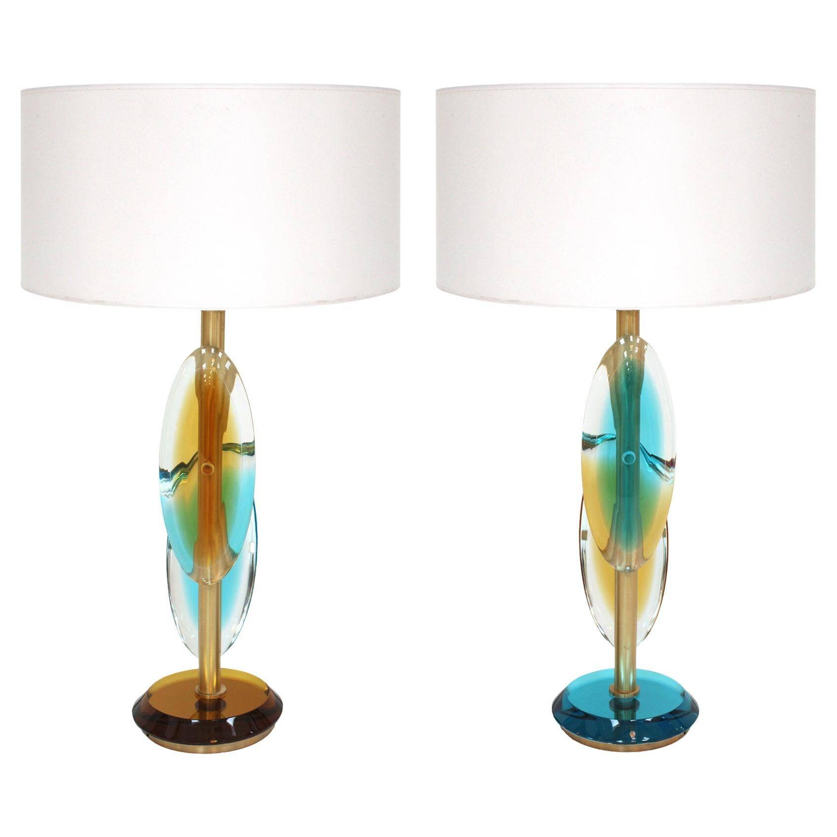 Pair of contemporary Murano glass lamps with a brass structure, made in Italy.