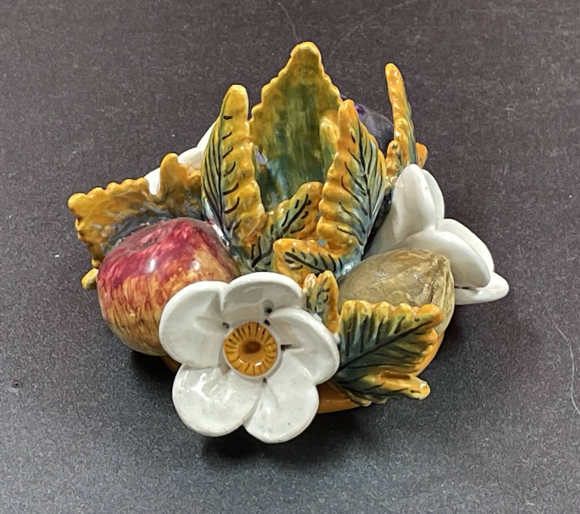 Candlestick with flowers and fruits in slip, Malicorne ceramic