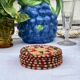 Round coaster made of natural wicker rattan, red and green