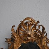 Miroir en stuc doré rocaille époque XIXème 110cm