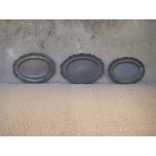 Three dishes in antique tin