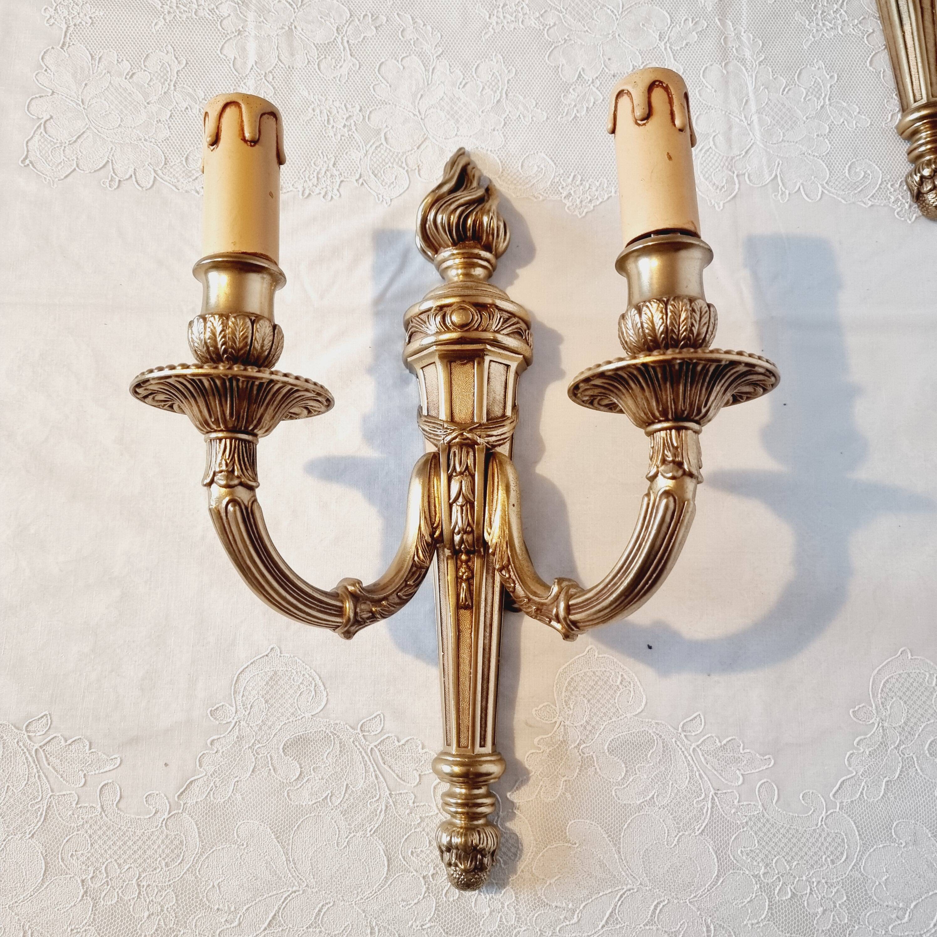 Pair of Louis XV style rocaille two-armed sconces in gilded bronze