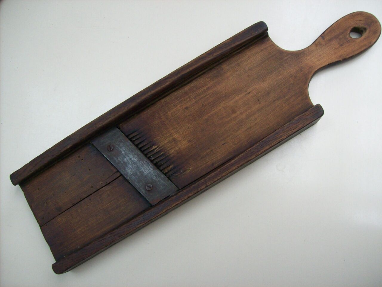Old kitchen mandolin in wood and iron double blades