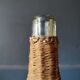 Old bottle dressed in wicker.