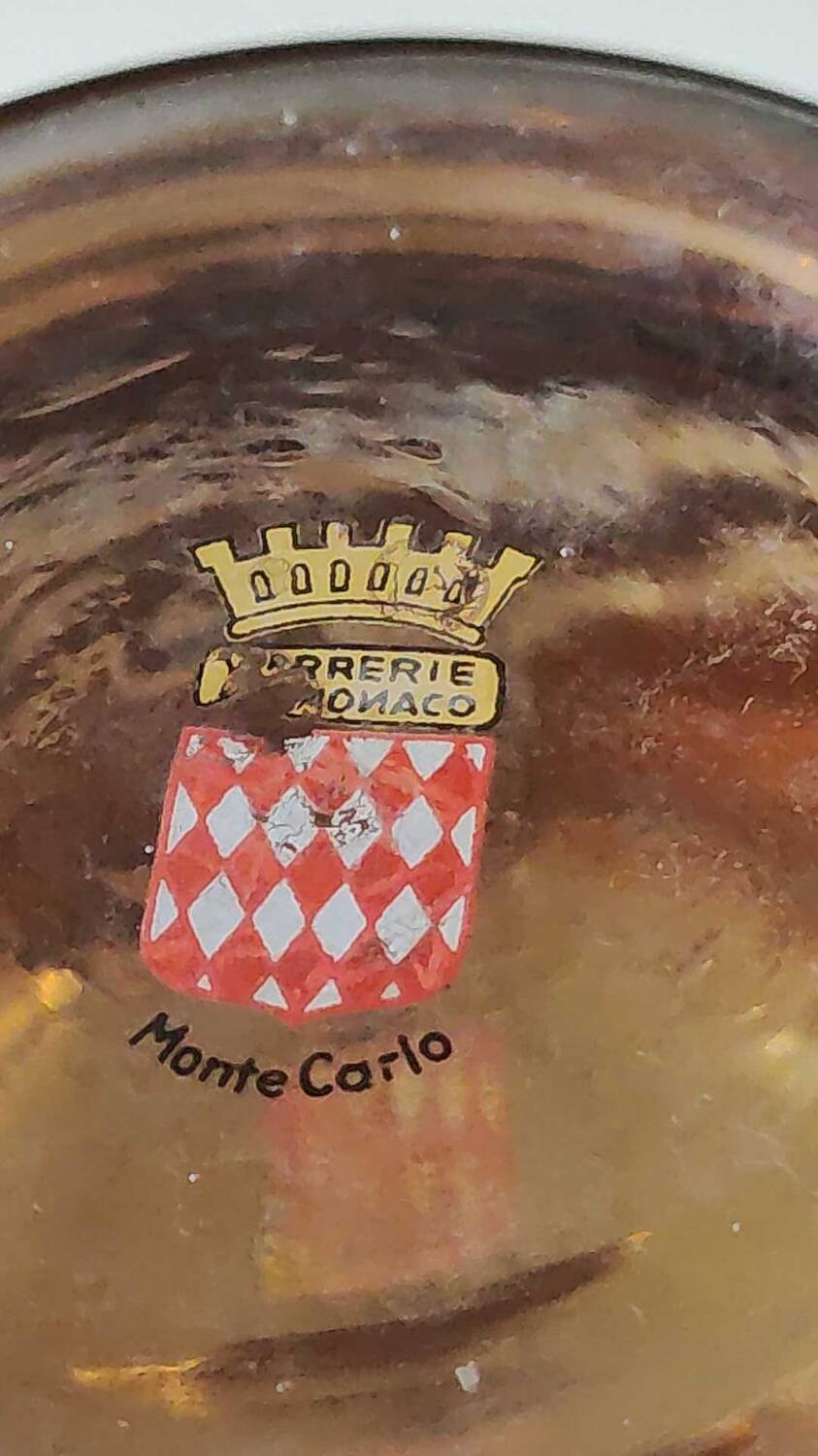 Ball vase stamped Verrerie de Monaco/Monte Carlo. In gold granite glass