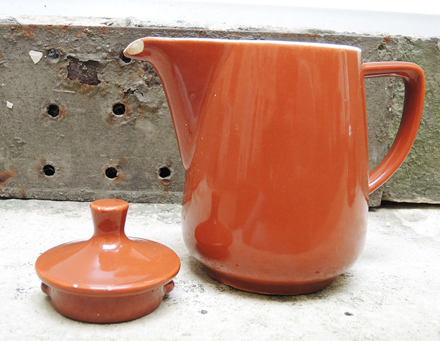 Old brown ceramic coffee maker