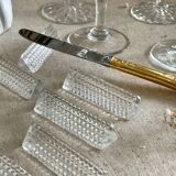 12 portes couteaux en verre.