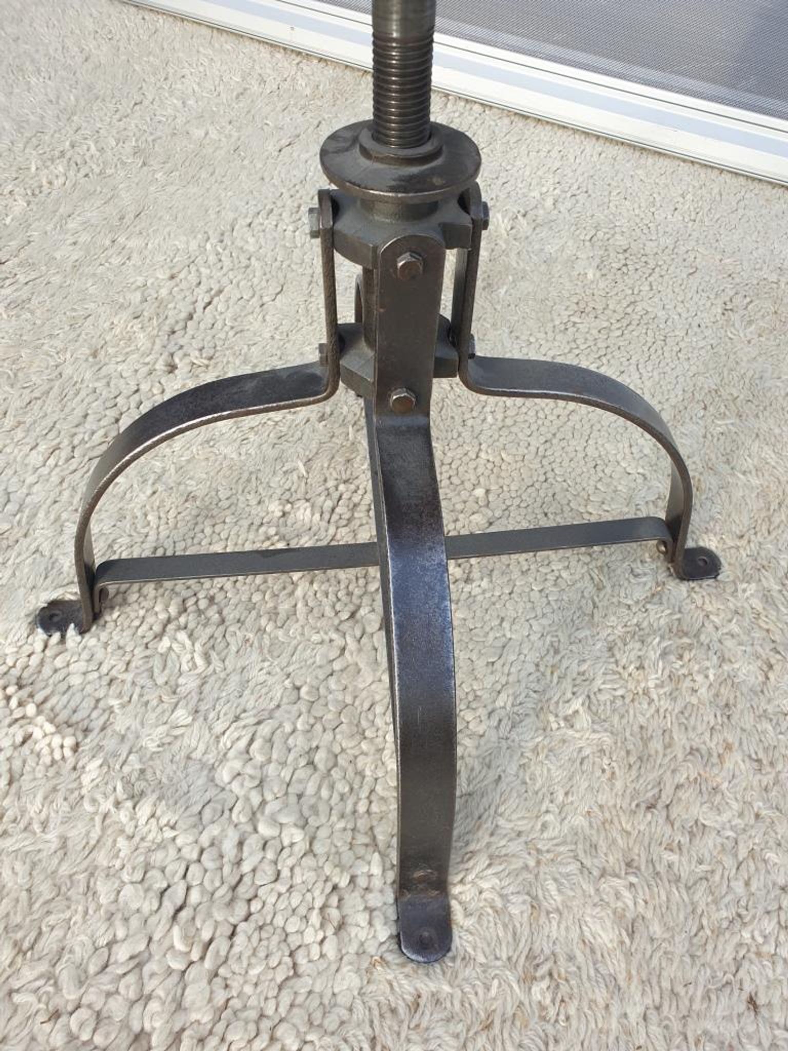 Bienaise stool of the years 1935, model 203 with 4 flat iron cathedral legs joined by a