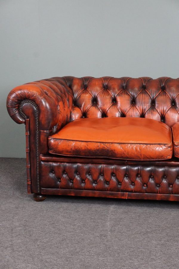 Chesterfield sofa in patinated orange leather, 2.5 seats