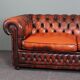 Chesterfield sofa in patinated orange leather, 2.5 seats