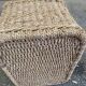 Large basket / rectangular storage bin made of woven natural fibre.