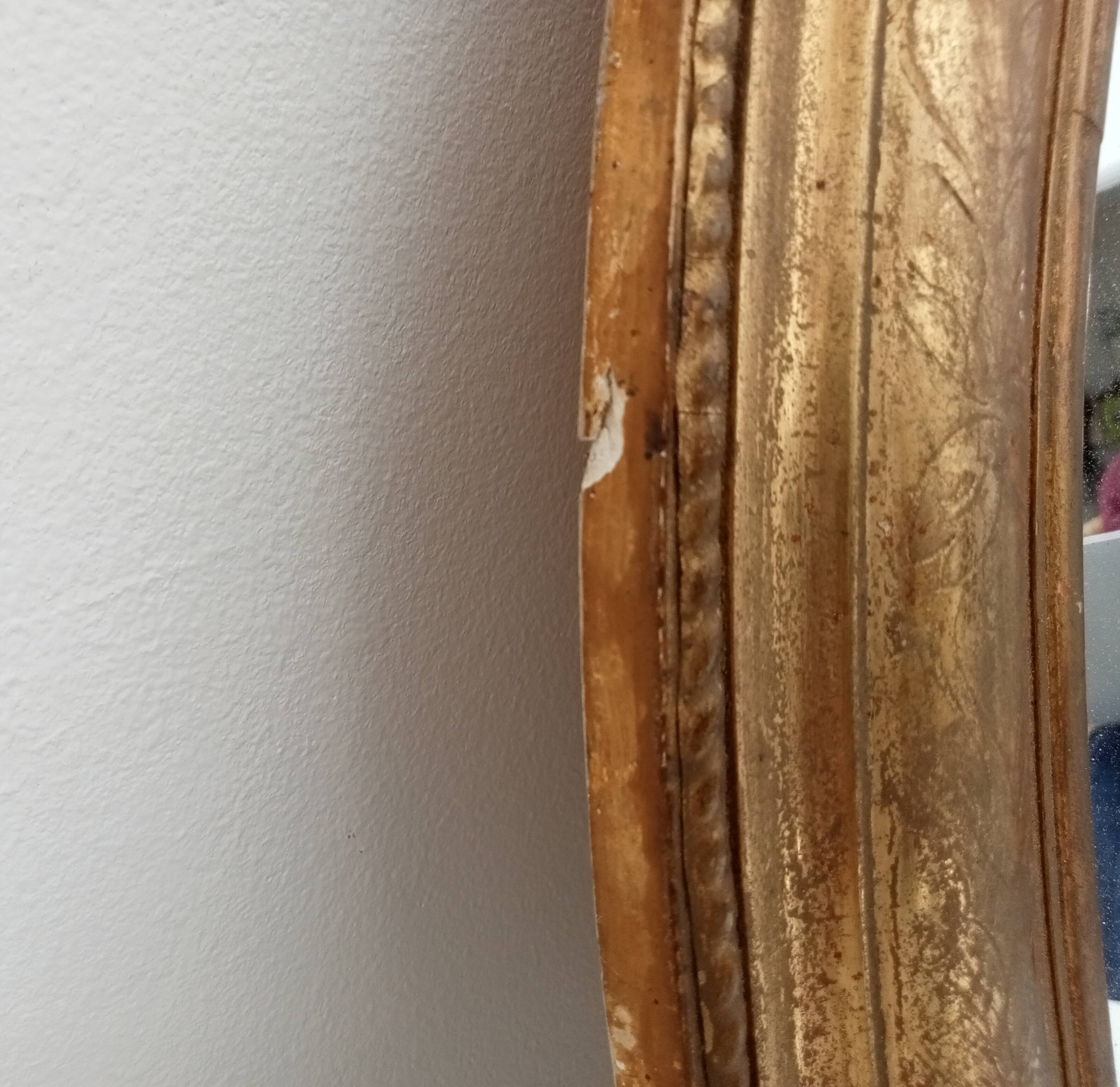 Louis Philippe 19th century oval gilded mirror in wood and stucco