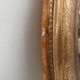 Louis Philippe 19th century oval gilded mirror in wood and stucco